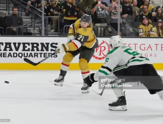 Dallas Stars v Vegas Golden Knights LAS VEGAS, NEVADA - OCTOBER 17: William Karlsson #71 of the Vegas Golden Knights\ shoots under pressure from Thomas Harley #55 of the Dallas Stars in overtime of their game at T-Mobile Arena on October 17, 2023 in Las Vegas, Nevada. The Golden Knights defeated the Stars 3-2 in a shootout. (Photo by Ethan Miller/Getty Images)