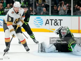 DALLAS, TEXAS - NOVEMBER 22: Jack Eichel #9 of the Vegas Golden Knights controls the puck in front of Jake Oettinger #29 of the Dallas Stars during overtime at American Airlines Center on November 22, 2023 in Dallas, Texas. (Photo by Sam Hodde/Getty Images)