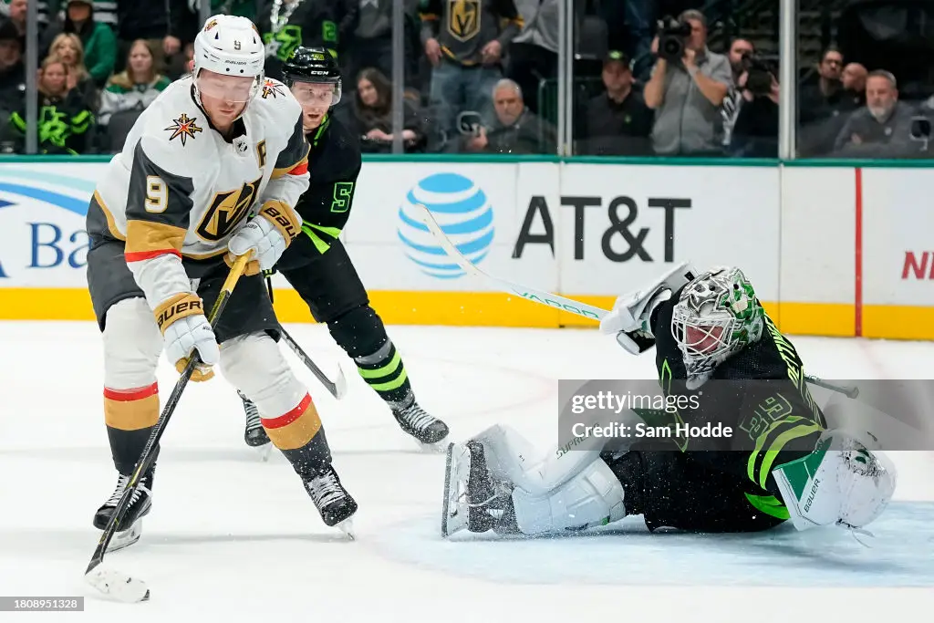 DALLAS, TEXAS - NOVEMBER 22: Jack Eichel #9 of the Vegas Golden Knights controls the puck in front of Jake Oettinger #29 of the Dallas Stars during overtime at American Airlines Center on November 22, 2023 in Dallas, Texas. (Photo by Sam Hodde/Getty Images)